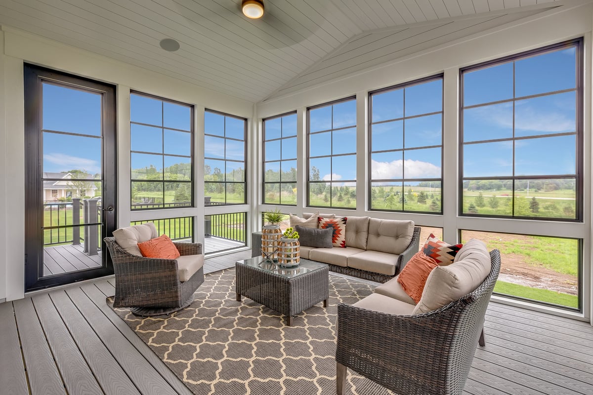 A bright four season sunroom addition, perfect for entertaining friends in the winter while still feeling like you're outdoors.