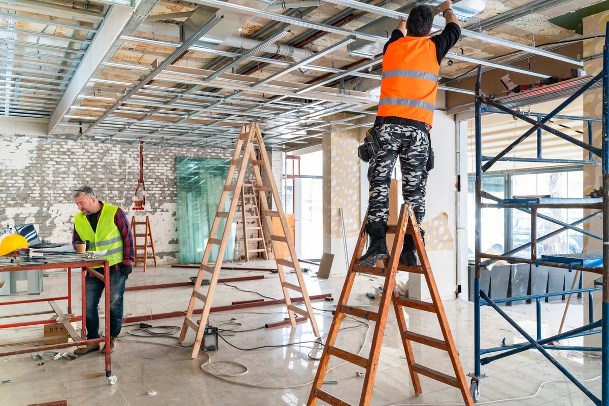 Construction worker, engineer or architect on site of building project inside of construction site