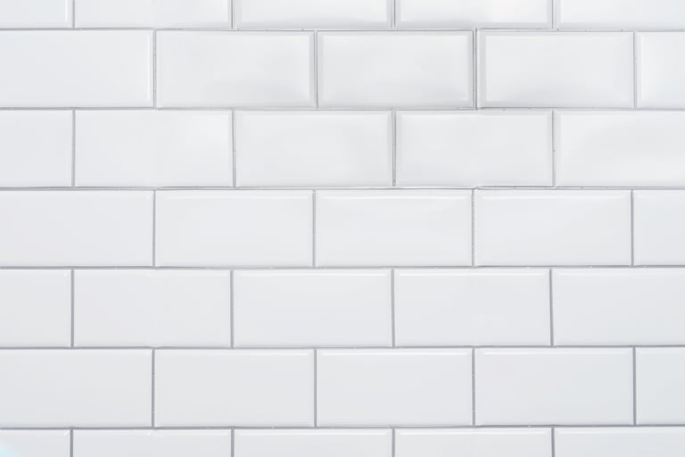 White subway tile wall close-up texture for modern bathroom.