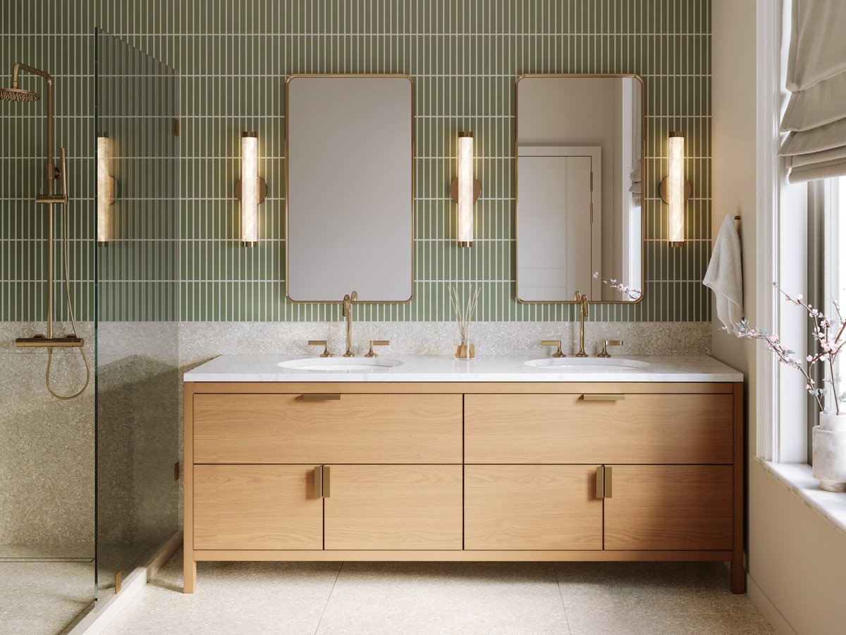 Remodeled bathroom in Maumee Ohio with a tiled walk-in shower, brass fixtures, marble vanity and terrazzo floor tile