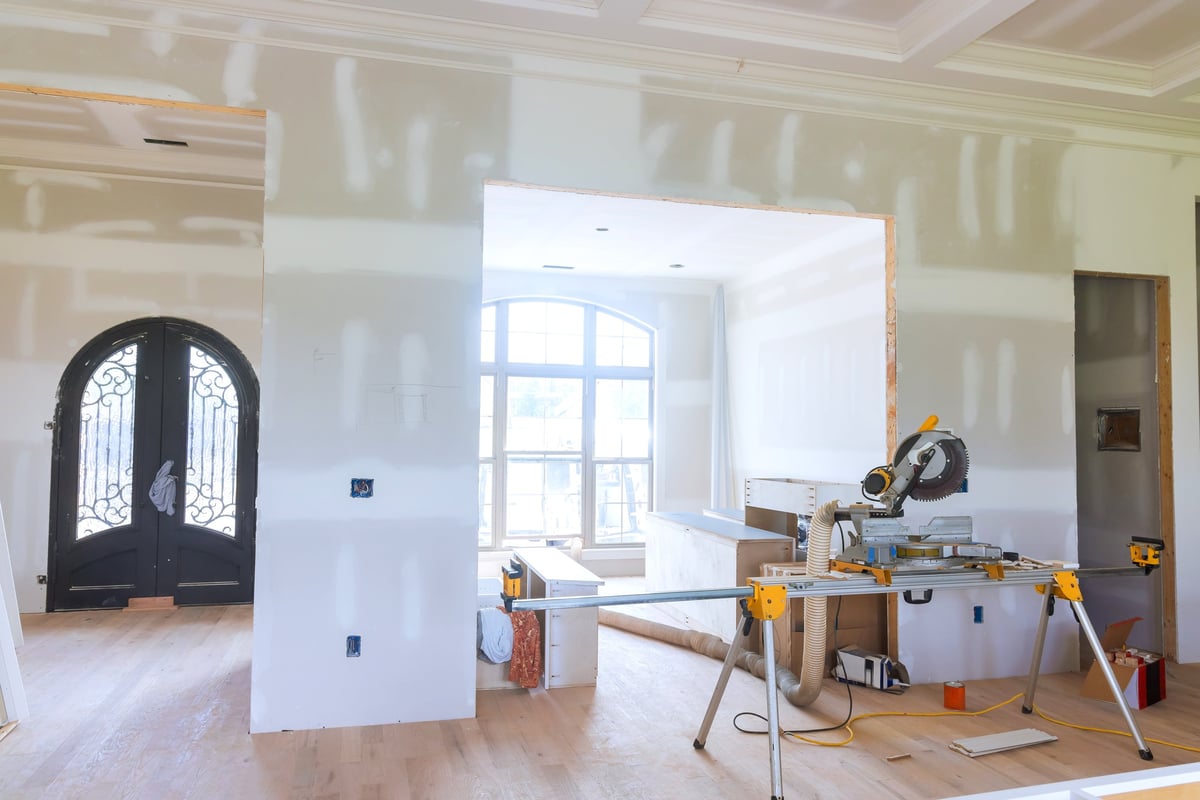 Prepare modern living space during home renovation featuring tools unfinished walls during works day