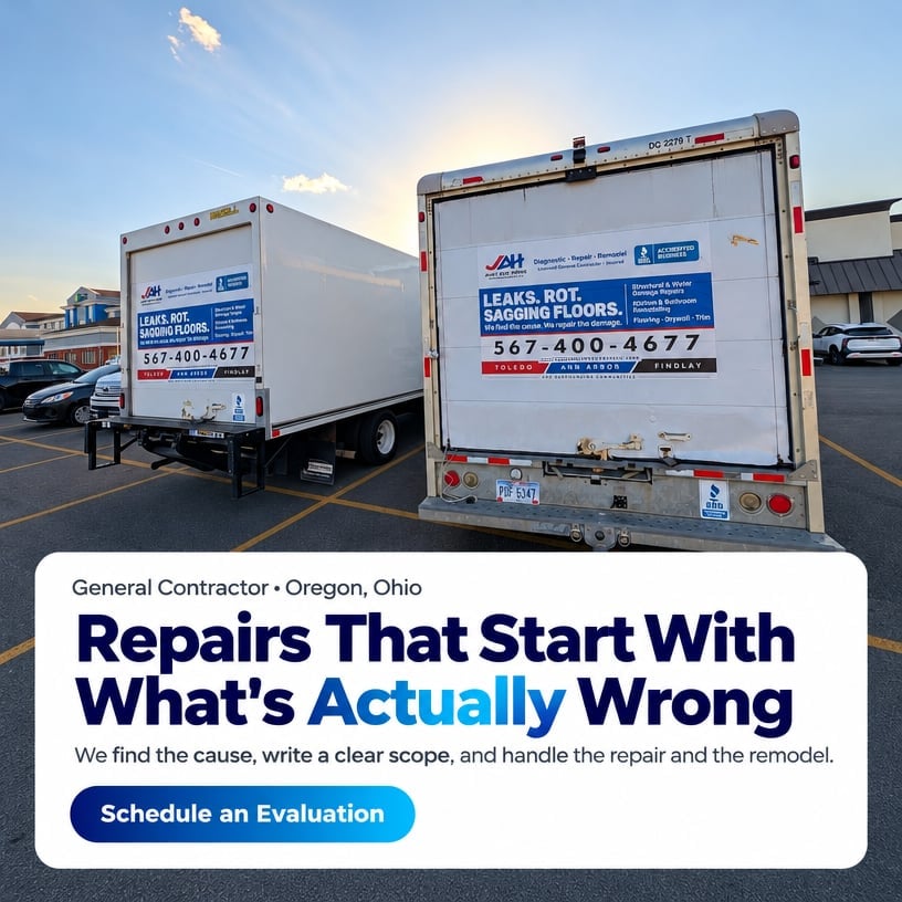 Two white general contractor service trucks in Oregon, Ohio advertising repairs and remodeling services