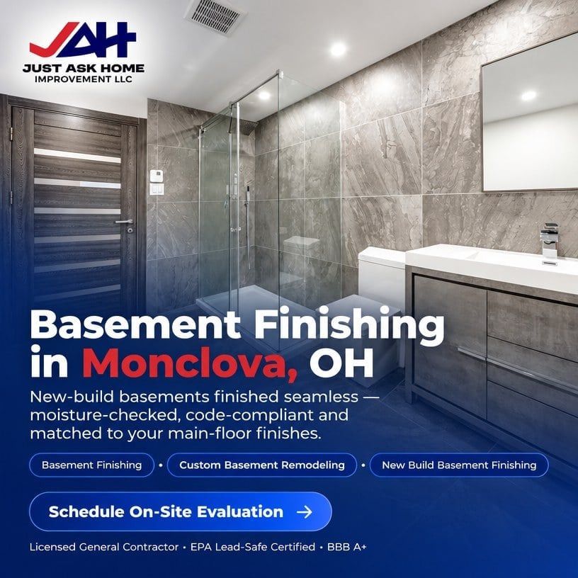 Modern finished basement bathroom with glass walk-in shower, marble tile walls and floating vanity in Monclova, Ohio
